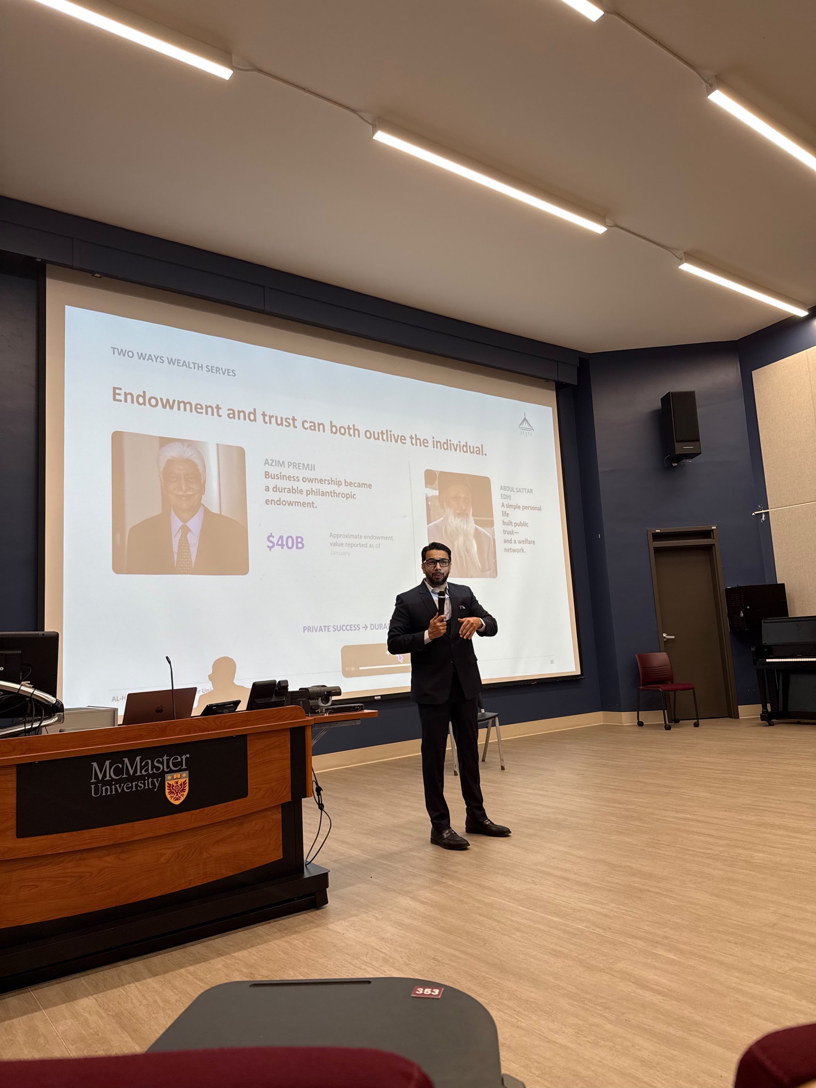 Syed Najam presenting Can You Be Rich and Righteous to a live audience