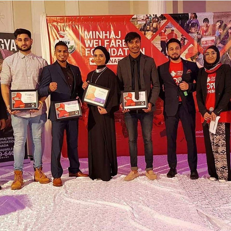 Syed Najam with volunteers recognized for their community service in Canada