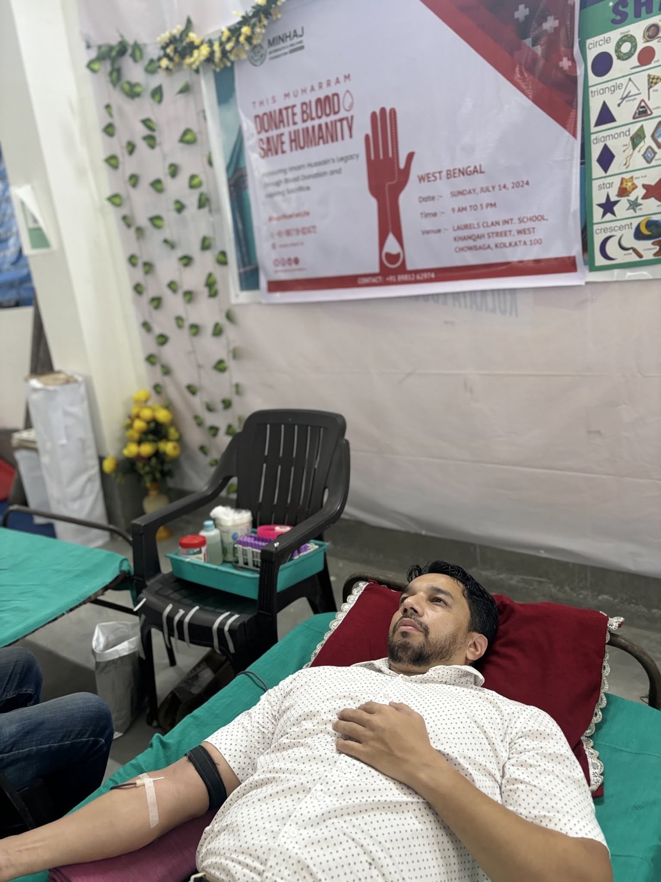Syed Najam donating blood during a community health initiative in West Bengal
