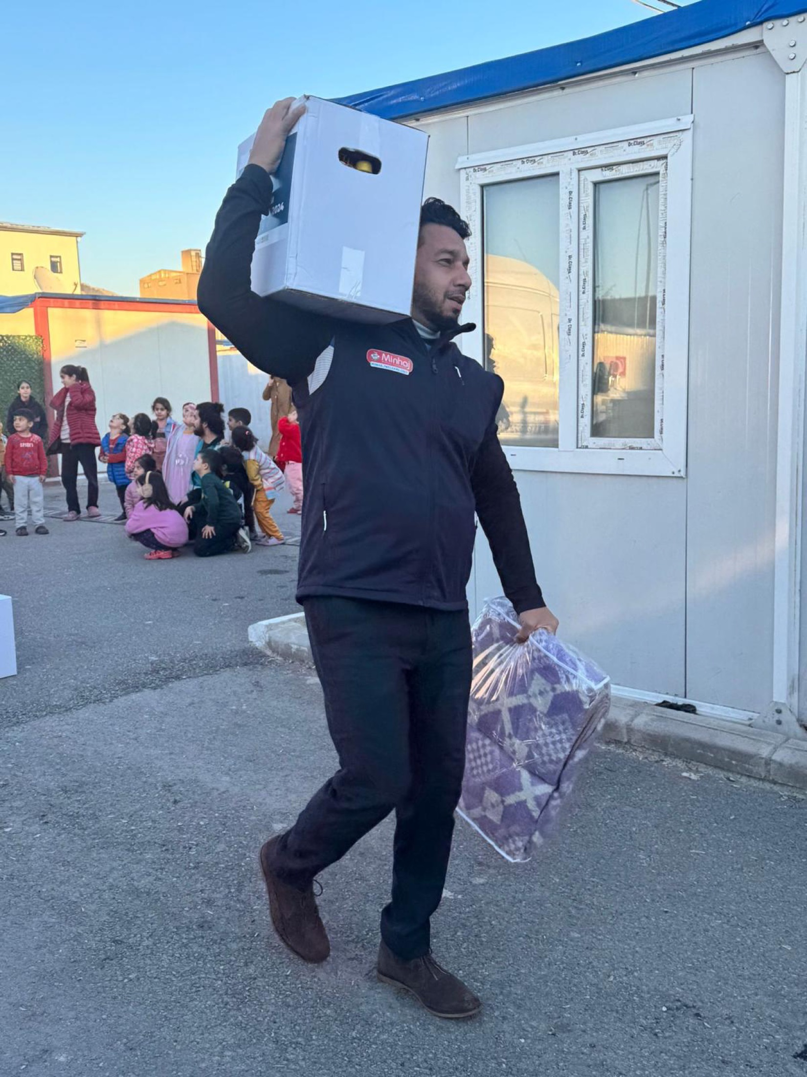 Syed Najam carrying winter essentials for families affected by the earthquakes in Türkiye