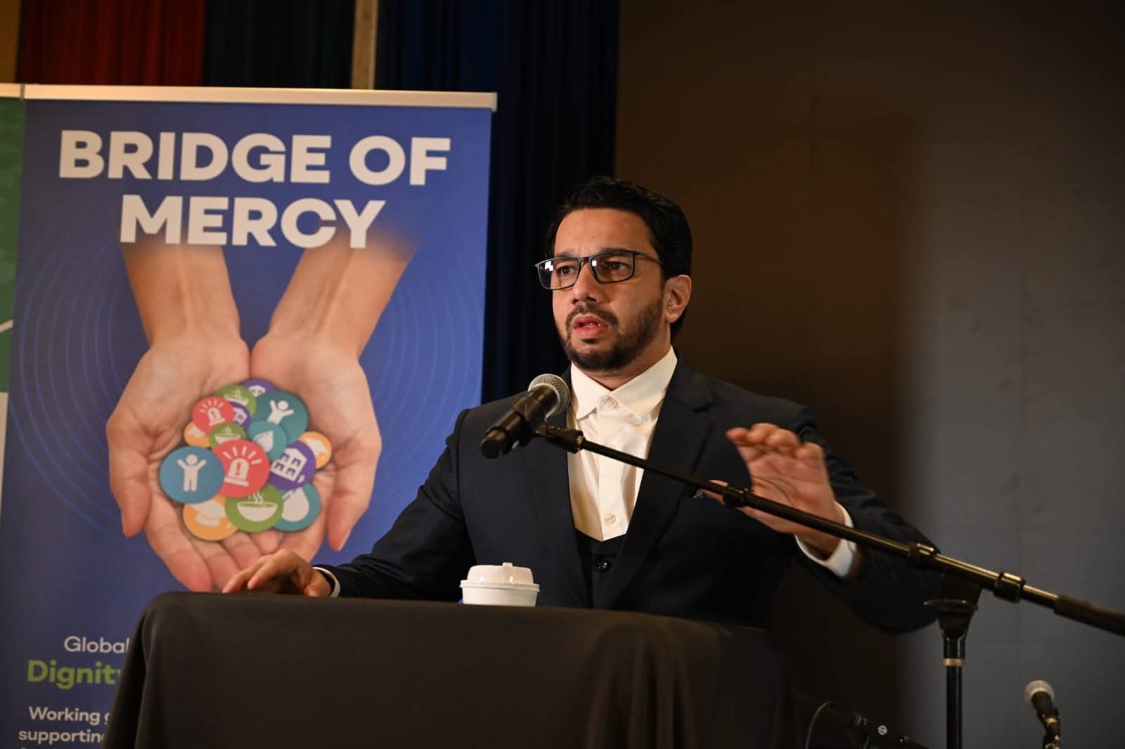 Syed Najam speaking at an orphan-care fundraising event in the United States